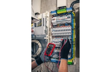 man-electrical-technician-working-switchboard-with-fuses